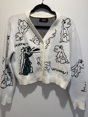 Cider Cream Cardigan with Teal & Black Cartoon Dino Motif